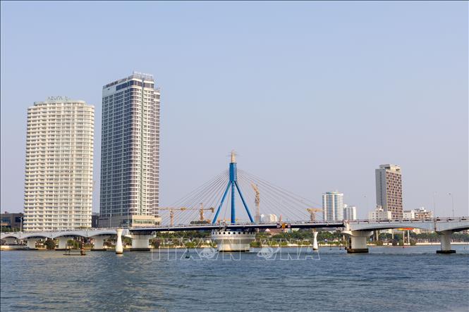 The Han River Bridge, Vietnam’s first swing bridge, with many construction projects underway on both banks. VNA Photo: Xuân Quý