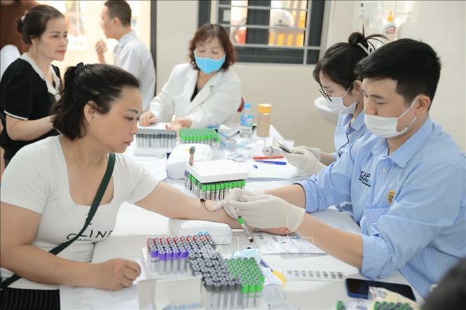 Chương trình góp phần nâng cao chất lượng chăm sóc sức khỏe ban đầu cho người dân theo định hướng chuyển từ “chữa bệnh” sang “chủ động phòng bệnh” theo tinh thần Nghị quyết 72 của Bộ Chính trị về một số giải pháp đột phá, tăng cường bảo vệ, chăm sóc và nâng cao sức khỏe cho nhân dân. Ảnh: Minh Quyết - TTXVN