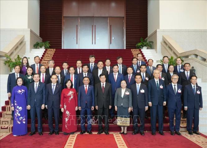 Tổng Bí thư, Chủ tịch nước Lào Thongloun Sisoulith, Thường trực Ban Bí thư Trần Cẩm Tú cùng các đại biểu dự buổi tiếp. Ảnh: Phương Hoa - TTXVN