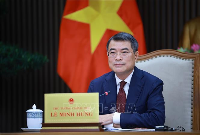 Thủ tướng Lê Minh Hưng điện đàm với Thủ tướng Singapore Lawrence Wong. Ảnh: Dương Giang-TTXVN