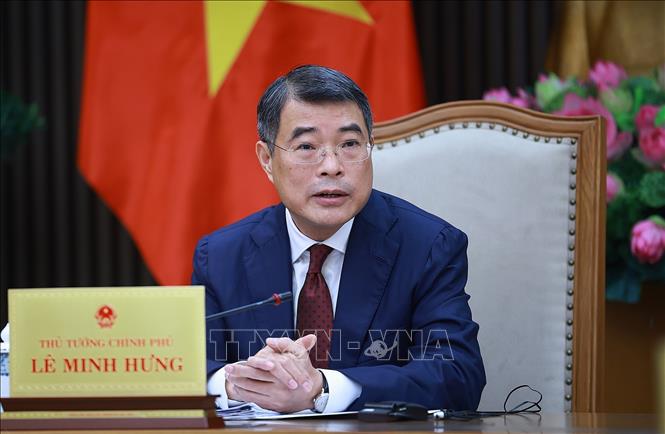 Thủ tướng Lê Minh Hưng điện đàm với Thủ tướng Singapore Lawrence Wong. Ảnh: Dương Giang-TTXVN