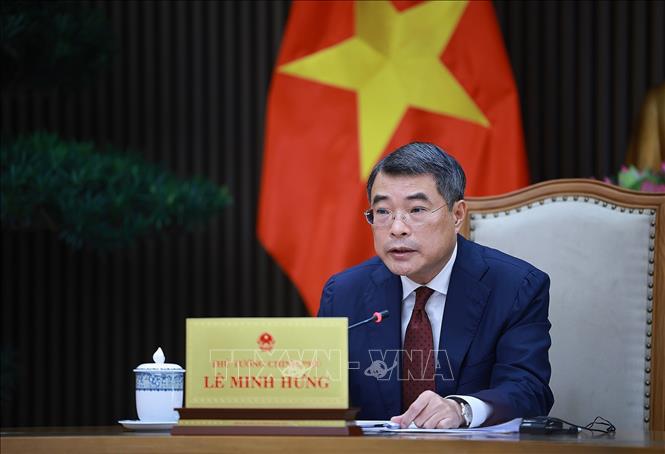 Thủ tướng Lê Minh Hưng điện đàm với Thủ tướng Singapore Lawrence Wong. Ảnh: Dương Giang-TTXVN