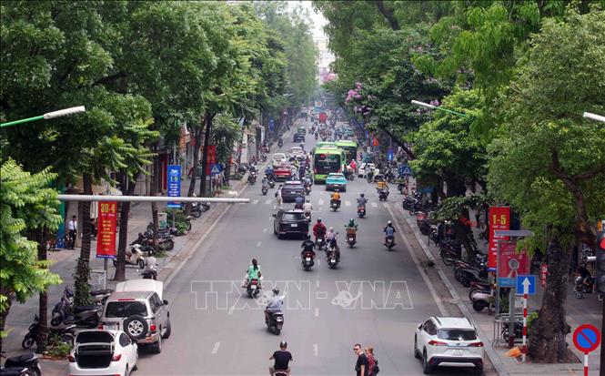 Dưới tiết trời mát mẻ và giao thông thông thoáng rất thích hợp cho người dân đi chơi trong kỳ nghỉ lễ. Ảnh: Phạm Kiên - TTXVN