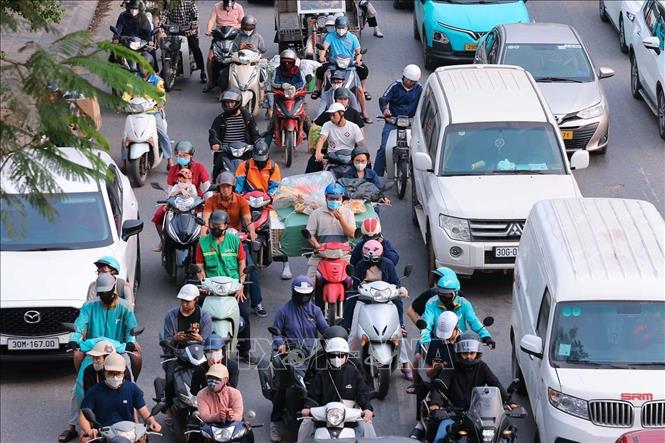 Lượng người và phương tiện tăng đột biến từ hướng phía Nam vào thành phố Hà Nội. Ảnh: Hoàng Hiếu - TTXVN