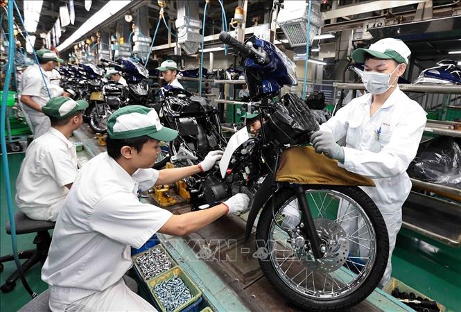 Dây chuyền sản xuất xe gắn máy tại nhà máy Honda Phúc Yên, Vĩnh Phúc. Ảnh: Trần Việt - TTXVN