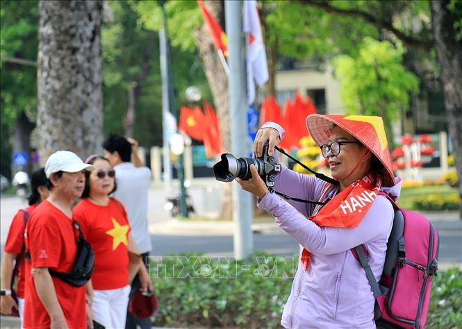 Lưu giữ những khoảnh khắc đẹp, ghi dấu ấn những ngày lịch sử của dân tộc. Ảnh: Tuấn Anh - TTXVN