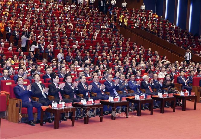 Party General Secretary and State President To Lam and delegates attend the opening session. VNA Photo