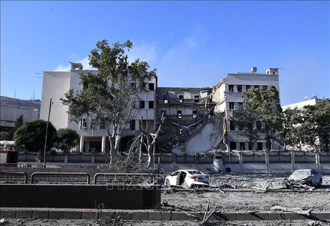 Tòa nhà bị phá hủy do xung đột tại Damascus, Syria. Ảnh: THX/TTXVN