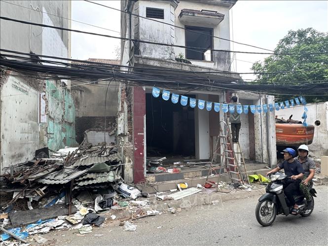 Một số hộ gia đình trên phố Trung kính đã hoàn tât việc bàn giao mặt bằng cho chính quyền địa phương. Ảnh: Quốc Lũy - TTXVN