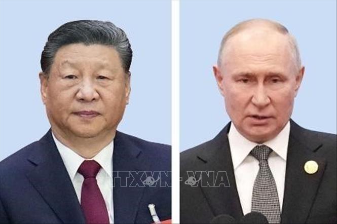 Chủ tịch Trung Quốc Tập Cận Bình (trái) và Tổng thống Nga Vladimir Putin. Ảnh: Kyodo/TTXVN