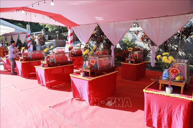 Truy điệu và an táng hài cốt liệt sĩ Quân tình nguyện và chuyên gia Việt Nam hy sinh trên nước bạn Lào. Ảnh: Nguyễn Nam-TTXVN