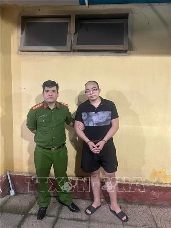 Đối tượng Phạm Ngọc Mạnh tại cơ quan Công an. Ảnh: TTXVN phát