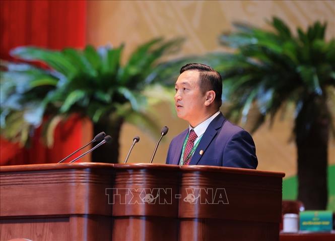 Chủ tịch Hội Nông dân tỉnh Bắc Ninh Nguyễn Hoàng Trung trình bày tham luận những đổi mới, sáng tạo về hoạt động hội tại tỉnh Bắc Ninh. Ảnh: Hoàng Hiếu - TTXVN