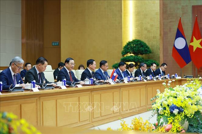 Thủ tướng Sonexay Siphandone và thành viên đoàn Lào tại cuộc hội đàm với Thủ tướng Lê Minh Hưng. Ảnh: Dương Giang – TTXVN

