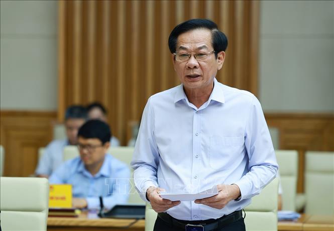 Bộ trưởng Bộ Nội vụ Đỗ Thanh Bình, Phó Chủ tịch Thường trực Hội đồng Thi đua - Khen thưởng Trung ương báo cáo sơ kết công tác thi đua, khen thưởng. Ảnh: Dương Giang – TTXVN 