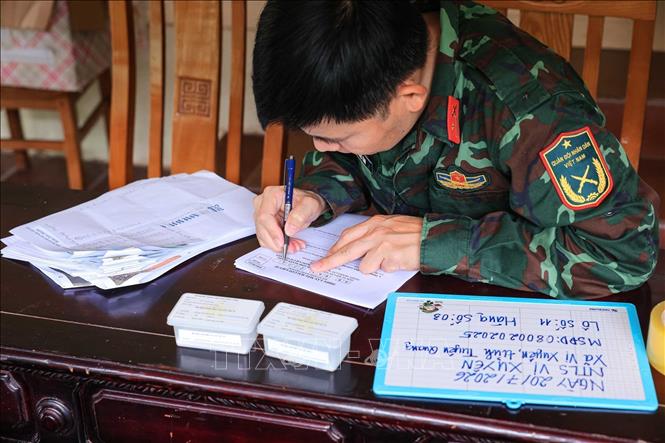 Detailed information on the martyrs' remains, including the recovery location, identification code, and planned burial site, is carefully recorded. VNA Photo: Hoàng Hiếu