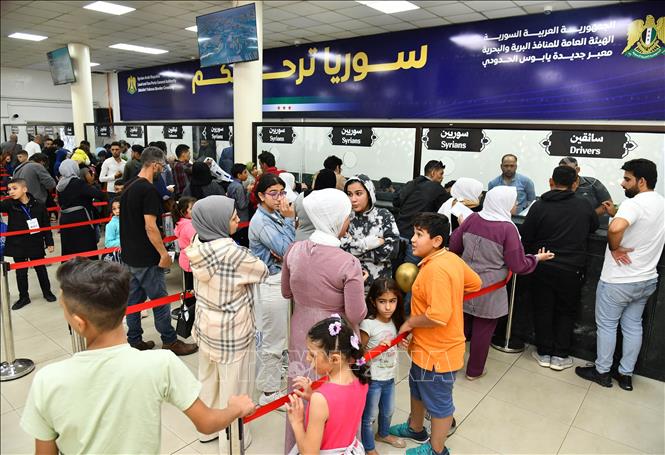 Người tị nạn Syria trở về nước từ Liban. Ảnh: THX/TTXVN phát