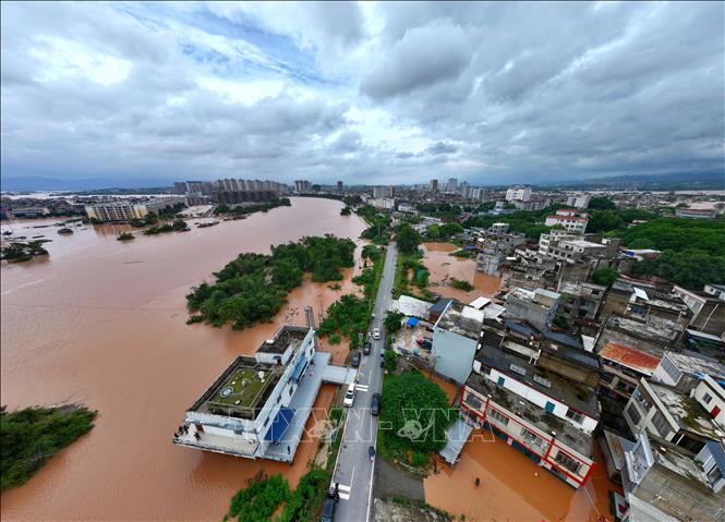 Nước sông Minh Giang dâng cao do mưa bão gây ngập lụt ở huyện Ninh Minh, Khu tự trị dân tộc Choang Quảng Tây, Trung Quốc ngày 24/8/2026. Ảnh: THX/TTXVN phát