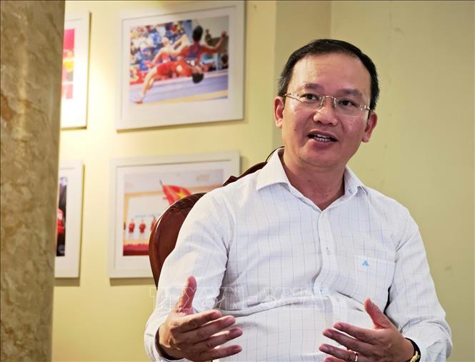 Phó Cục trưởng Cục Thể dục thể thao Việt Nam, Trưởng đoàn Thể thao Việt Nam tham dự ASIAD 20 Nguyễn Hồng Minh chia sẻ với phóng viên. Ảnh: Nam Sương - TTXVN