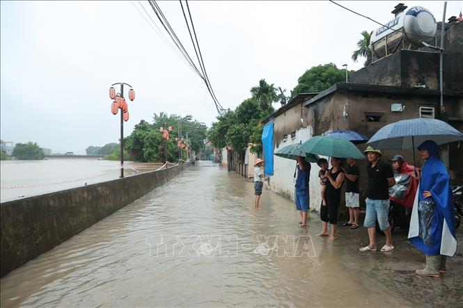 Nước sông dâng cao khu vực thôn Ninh Kiều (xã Quảng Bị). Ảnh: Minh Quyết - TTXVN
