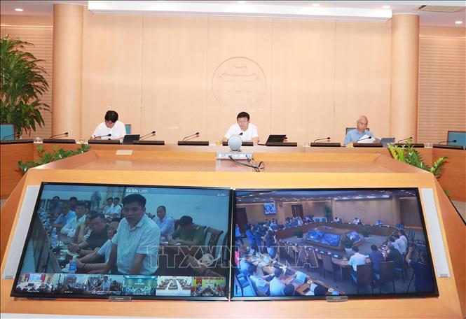Hội nghị tiếp nhận, tổng hợp ý kiến và trả lời nhân dân về điều chỉnh tổng thể Quy hoạch phân khu đô thị sông Hồng. Ảnh: Vũ Quang - TTXVN