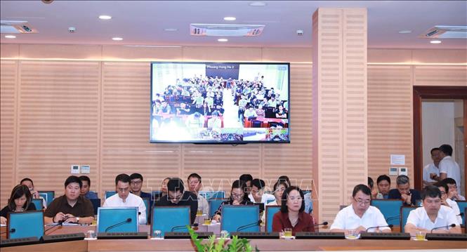 Hội nghị tiếp nhận, tổng hợp ý kiến và trả lời nhân dân về điều chỉnh tổng thể Quy hoạch phân khu đô thị sông Hồng. Ảnh: Vũ Quang - TTXVN