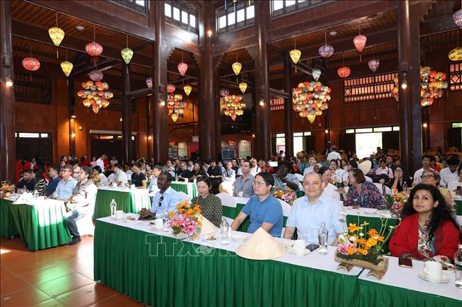 The UNESCO delegation watches a video introducing the site, its management, conservation and promotion of heritage values in association with ensuring local livelihoods. VNA Photo: Đức Phương 