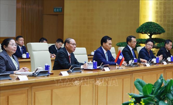 Thủ tướng Lê Minh Hưng hội kiến đồng chí Vilay Lakhamfong, Thường trực Ban Bí thư Trung ương Đảng Nhân dân Cách mạng Lào. Ảnh: Dương Giang – TTXVN
