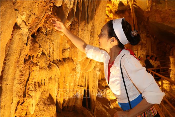 The cave extends approximately 60–70 metres and features stalactites and stalagmites formed over millions of years. VNA Photo: Thùy Dung 