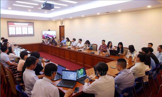 Đảng viên thuộc Đảng bộ Thông tấn xã Việt Nam tham dự Hội nghị trực tuyến tại điểm cầu trụ sở Thông tấn Quốc gia (5 Lý Thường Kiệt, Hà Nội). Ảnh: Phạm Kiên - TTXVN