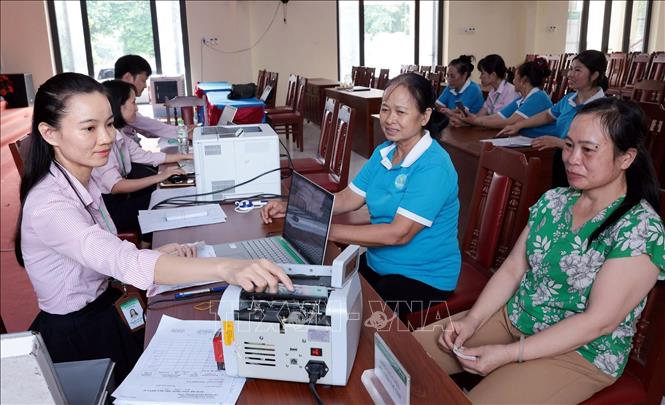 Một buổi giao dịch tại điểm giao dịch Lan Mẫu, xã Bắc Lũng, thành phố Bắc Ninh. Ảnh: Trần Việt - TTXVN