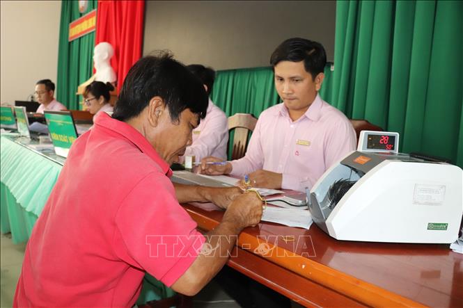 Chuyển đổi số nhằm hướng tới hoạt động tín dụng chính sách thuận tiện, an toàn và minh bạch hơn. Ảnh: Đức Hạnh - TTXVN 