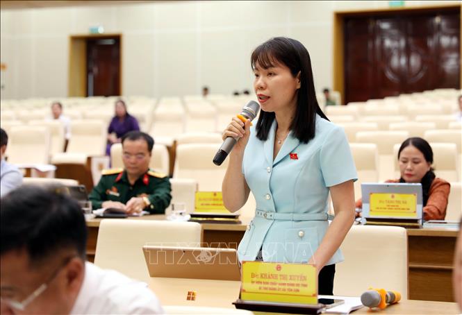 Các đại biểu thảo luận tại tổ. Ảnh: Quang Cường – TTXVN 