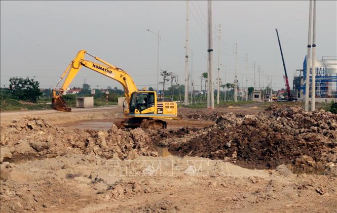 Thi công dự án xây dựng kết cấu hạ tầng Khu công nghiệp Đồng Văn III phía Đông đường cao tốc Cầu Giẽ - Ninh Bình. Ảnh: Nguyễn Chinh – TTXVN