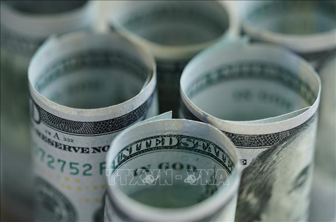 Đồng tiền mệnh giá 100USD tại Washington D.C., Mỹ. Ảnh: THX/TTXVN phát
