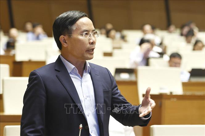 Thống đốc Ngân hàng Nhà nước Phạm Đức Ấn phát biểu giải trình, làm rõ một số vấn đề đại biểu Quốc hội nêu. Ảnh: Doãn Tấn – TTXVN