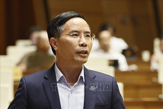 Thống đốc Ngân hàng Nhà nước Phạm Đức Ấn phát biểu giải trình, làm rõ một số vấn đề đại biểu Quốc hội nêu. Ảnh: Doãn Tấn – TTXVN